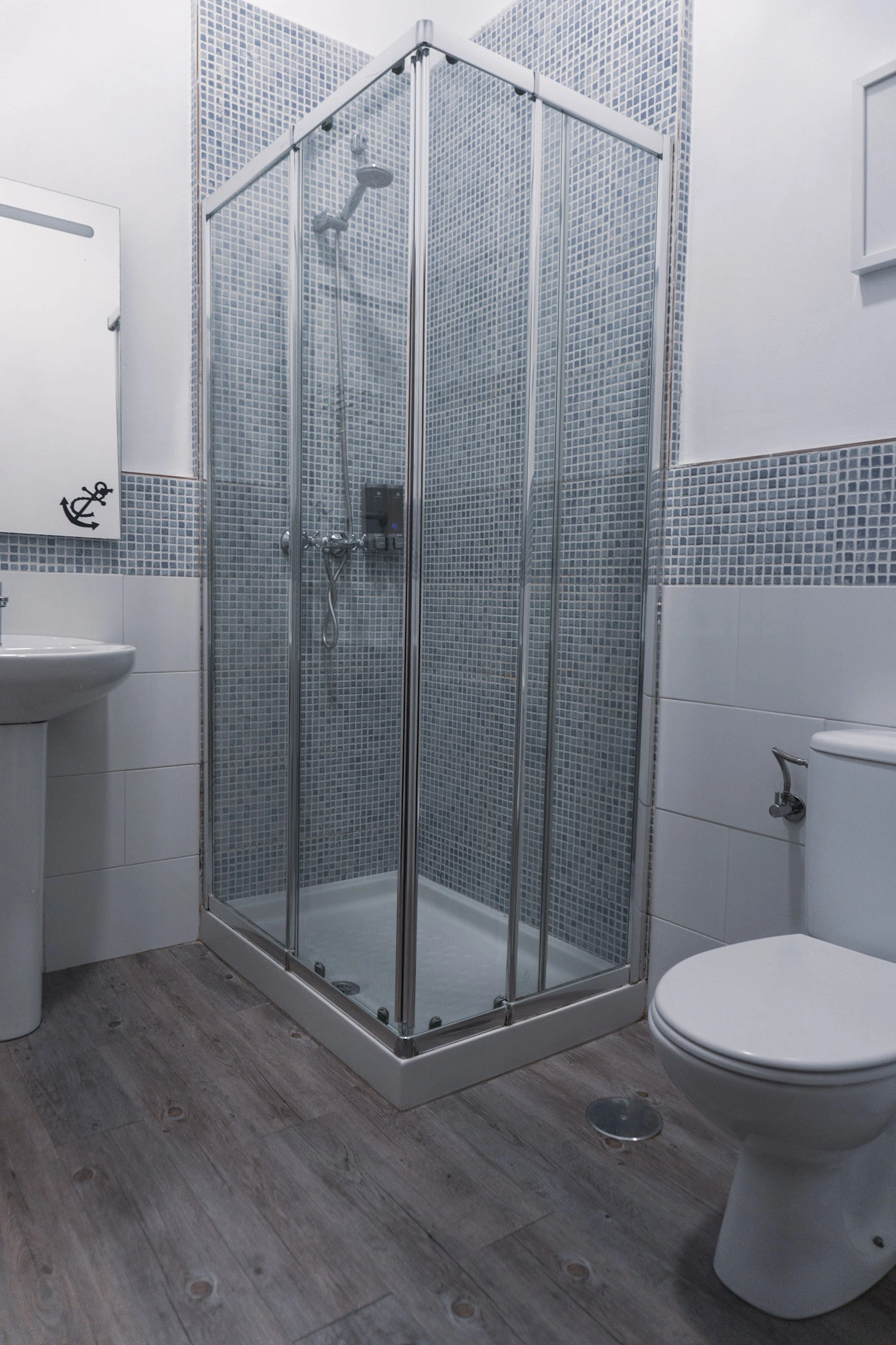 white tiled bathroom with sink